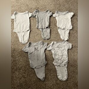Assorted newborn onesies